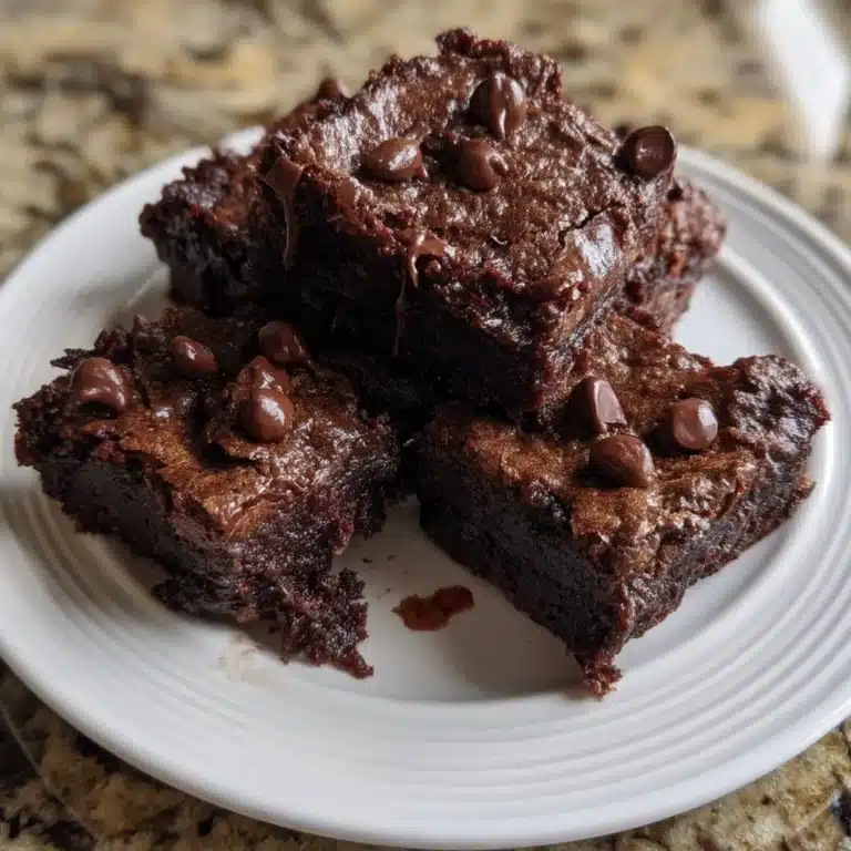 Fudgy Sweet Potato Brownies 15 Delicious fudgy sweet potato brownies on a wooden table.