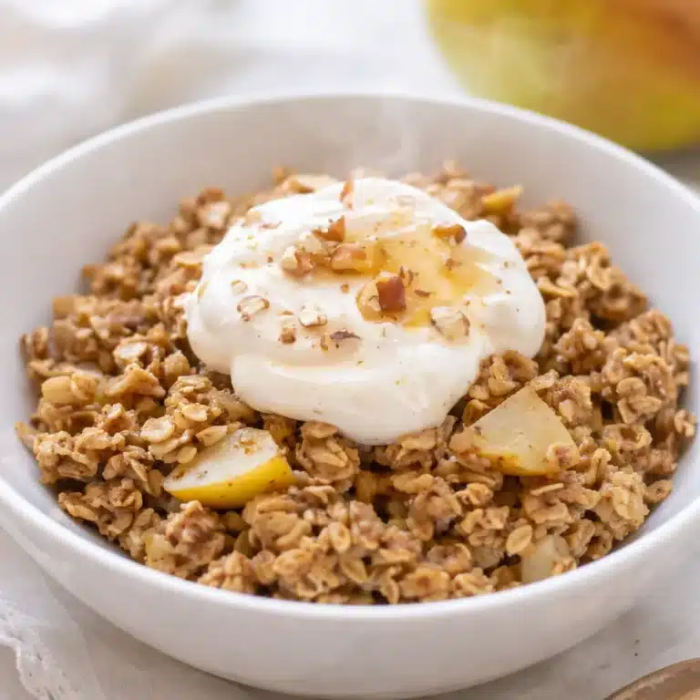 Warm Pear & Ginger Oatmeal with spices and fresh fruit in a bowl.