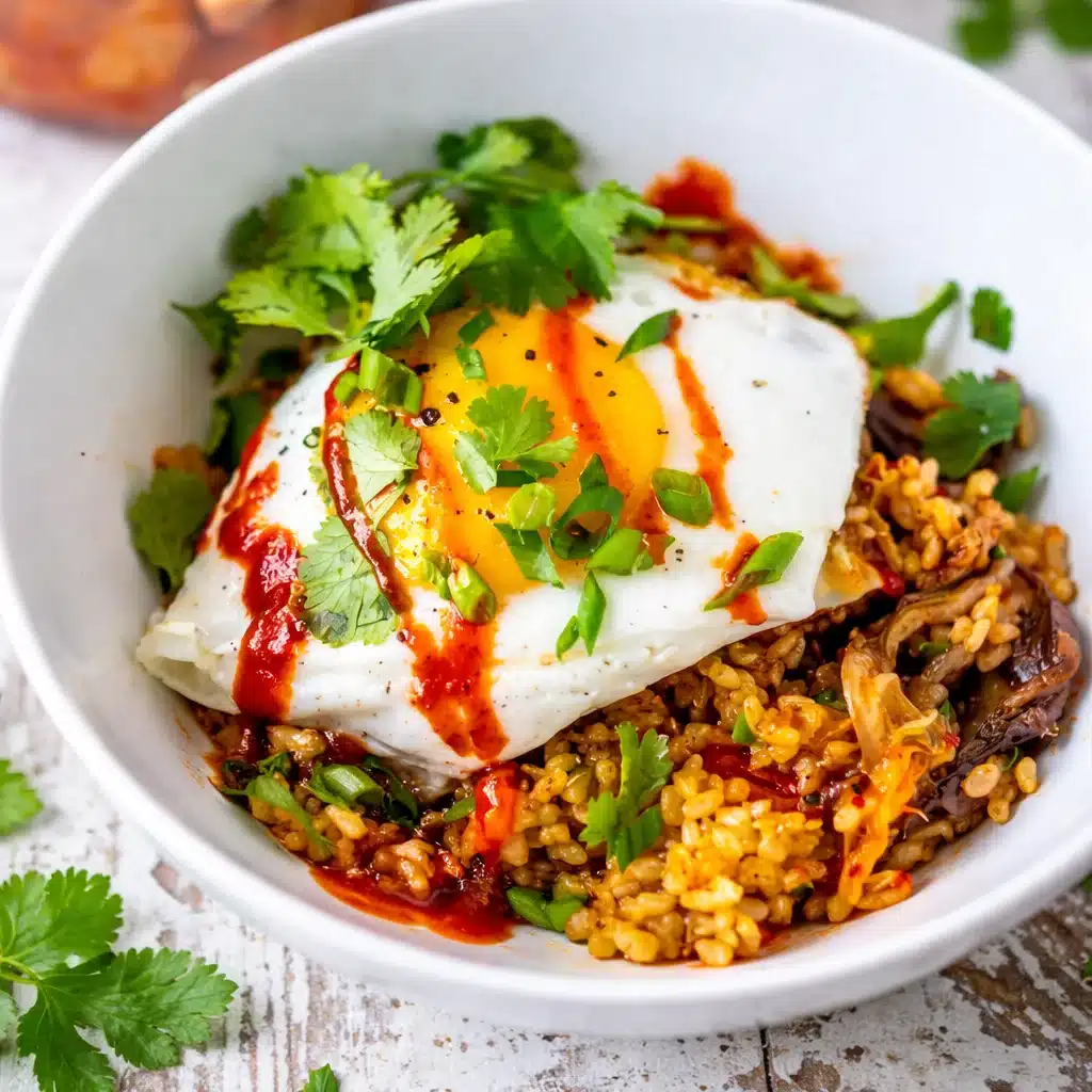 Quick and Tasty Kimchi Fried Rice (Gut Health Bomb) Recipe 1 A vibrant bowl of 2. Kimchi Fried Rice topped with fresh vegetables and eggs.