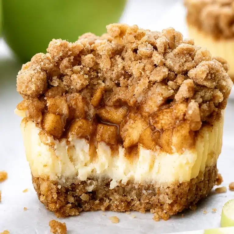 Deliciously Easy Apple Crisp Mini Cheesecakes to Savor 13 Delicious Apple Crisp Mini Cheesecakes with graham cracker crust and apple topping.