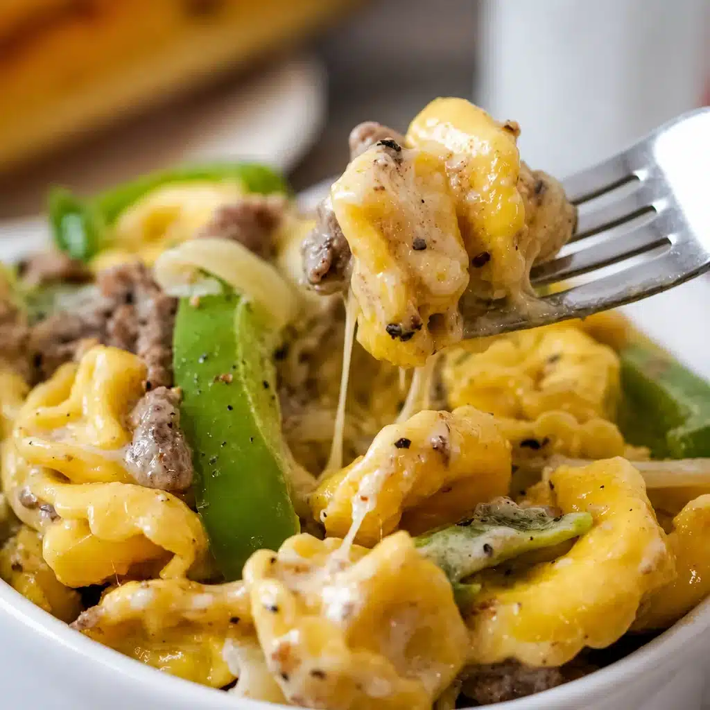 Creamy Crock Pot Cheesesteak Tortellini with beef, peppers, and cheese